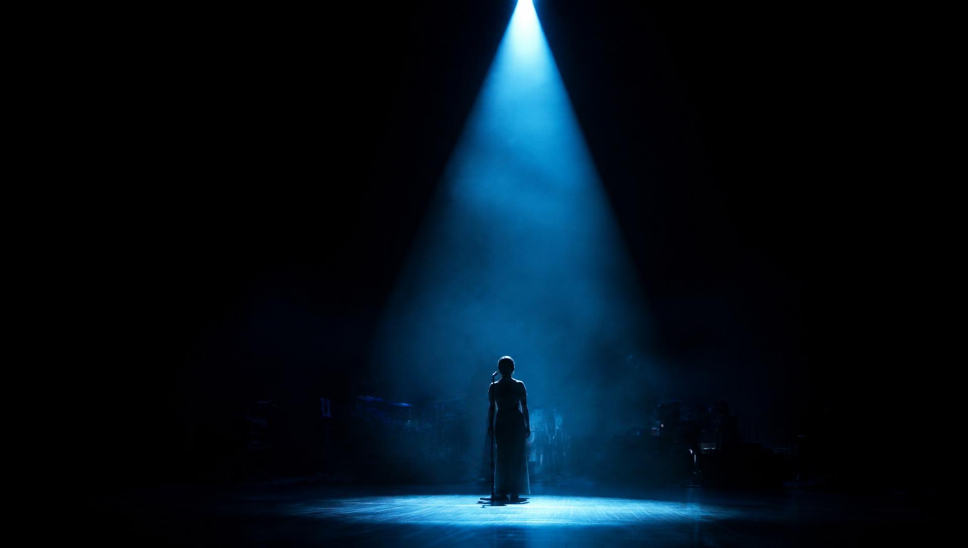 Performer under a spotlight